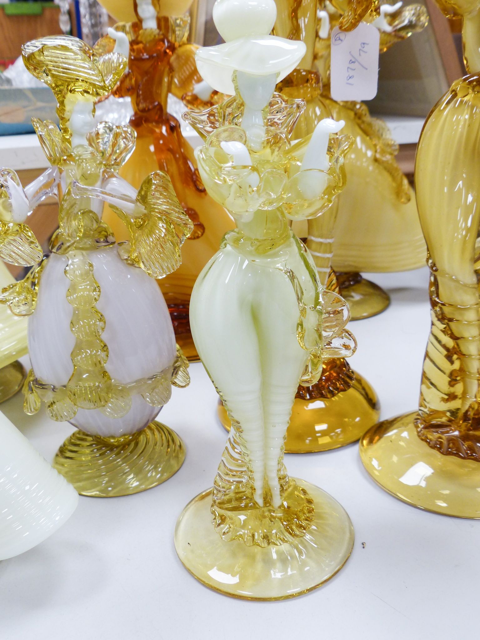 A collection of eight Murano amber glass figures, tallest 42cm